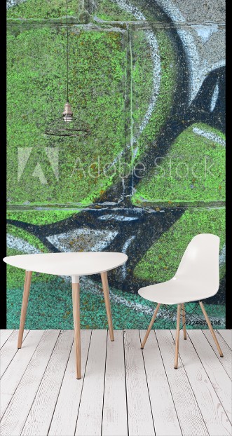 Picture of Fragment of graffiti drawings The old wall decorated with paint stains in the style of street art culture Colored background texture in green tones